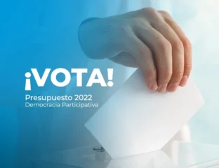 mano sujetando voto e introduciendo en la urna, democracia participativa ESI uclm