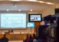 Video camera recording conference in the ESI assembly hall
