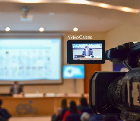 Video camera recording conference in the ESI assembly hall