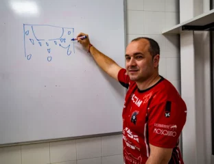Eusebio Angulo writing on a blackboard
