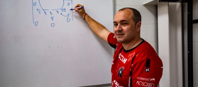 Eusebio Angulo writing on a blackboard