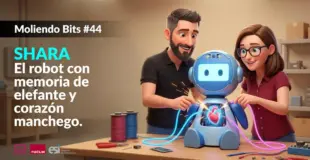 Ramón Hervas y Laura Villa manipulando un robot