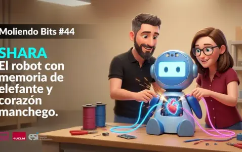 Ramón Hervas y Laura Villa manipulando un robot
