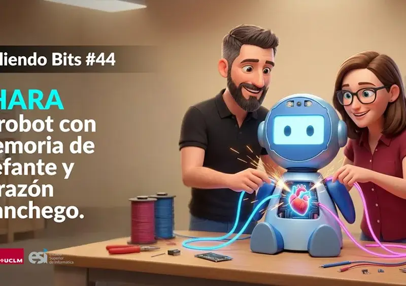 Ramón Hervas y Laura Villa manipulando un robot